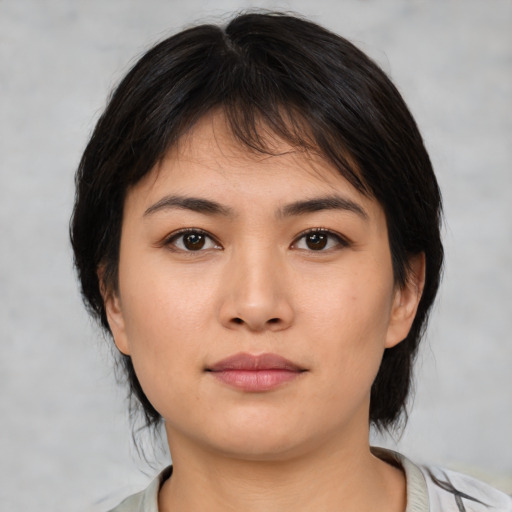 Neutral asian young-adult female with medium  brown hair and brown eyes