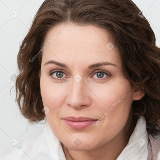 Joyful white young-adult female with medium  brown hair and green eyes