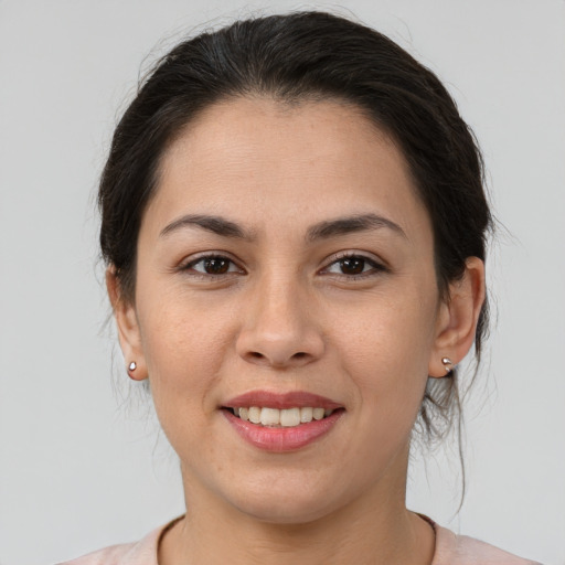 Joyful asian young-adult female with medium  brown hair and brown eyes