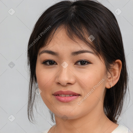 Joyful asian young-adult female with medium  brown hair and brown eyes