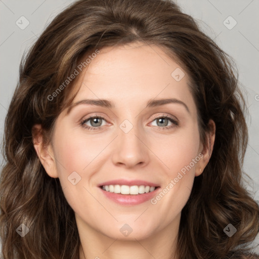 Joyful white young-adult female with long  brown hair and green eyes