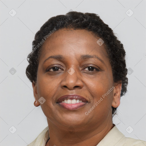 Joyful black adult female with short  brown hair and brown eyes