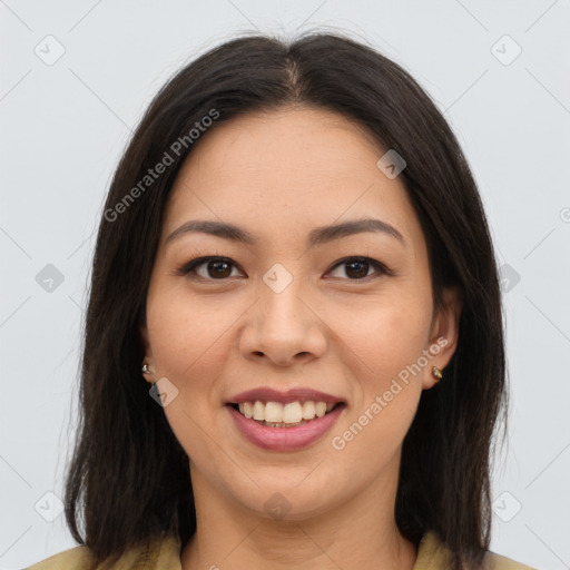 Joyful latino young-adult female with long  brown hair and brown eyes