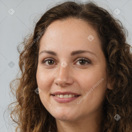 Joyful white adult female with long  brown hair and brown eyes