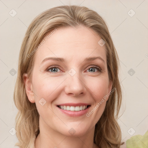 Joyful white young-adult female with medium  brown hair and green eyes