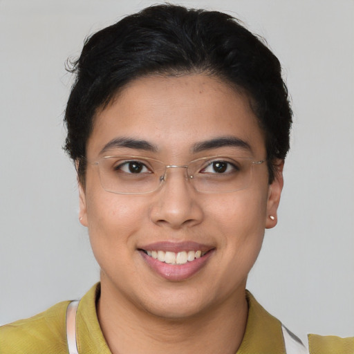 Joyful latino young-adult female with short  brown hair and brown eyes