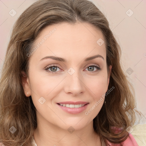 Joyful white young-adult female with medium  brown hair and green eyes