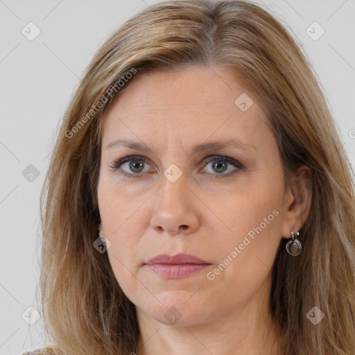 Joyful white adult female with long  brown hair and brown eyes