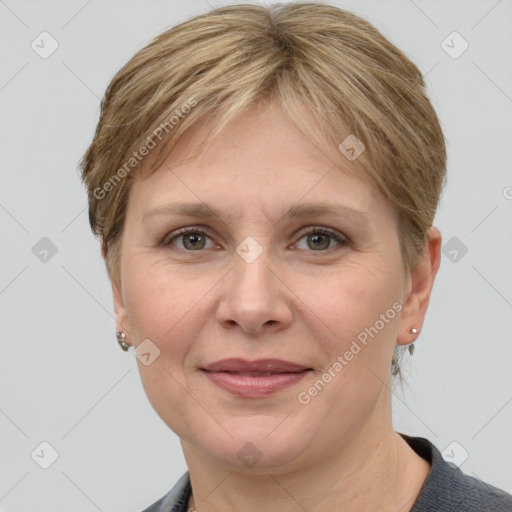 Joyful white adult female with short  brown hair and grey eyes