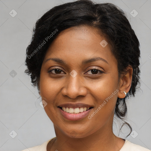 Joyful black young-adult female with medium  brown hair and brown eyes