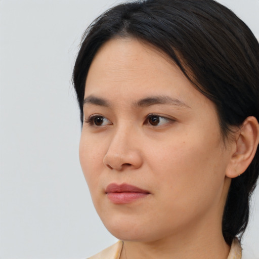 Neutral asian young-adult female with medium  brown hair and brown eyes