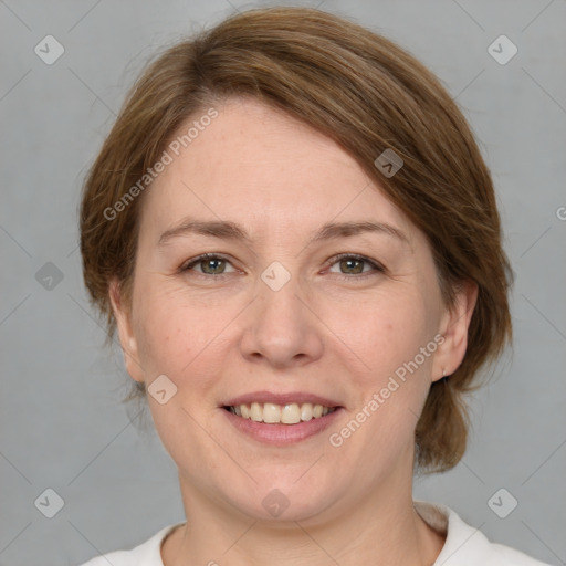 Joyful white adult female with medium  brown hair and green eyes