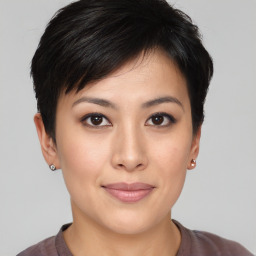 Joyful asian young-adult female with short  brown hair and brown eyes