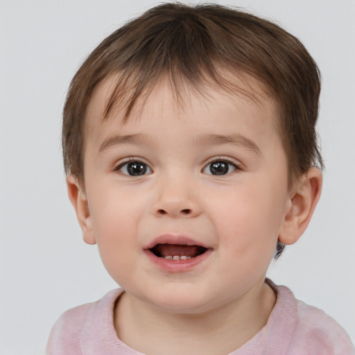 Joyful white child male with short  brown hair and brown eyes