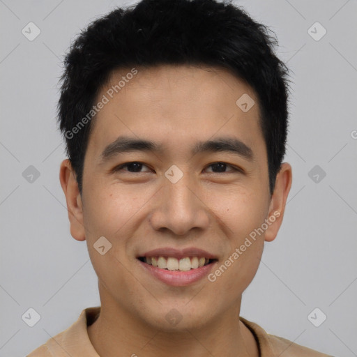 Joyful asian young-adult male with short  black hair and brown eyes