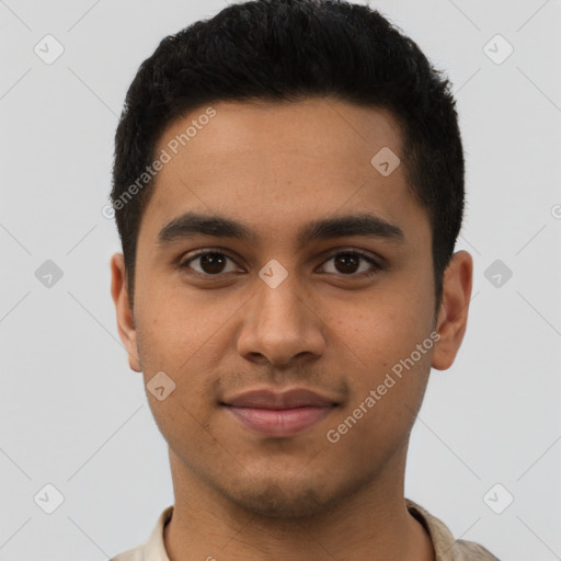 Joyful latino young-adult male with short  brown hair and brown eyes