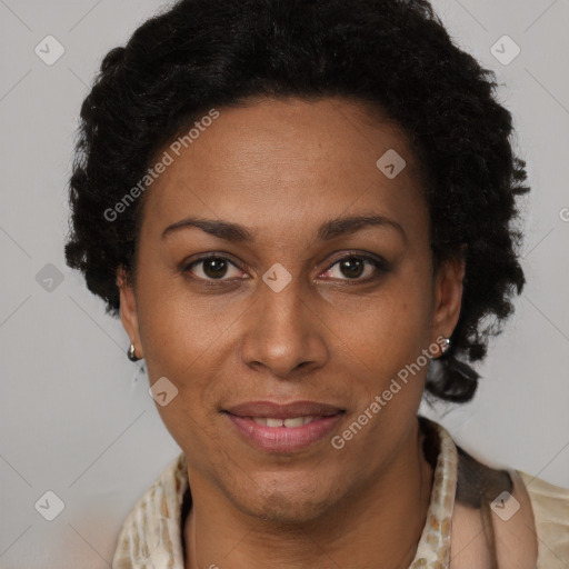 Joyful black adult female with short  brown hair and brown eyes