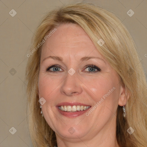 Joyful white adult female with medium  brown hair and blue eyes