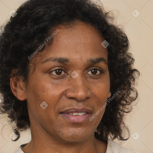 Joyful black adult female with short  brown hair and brown eyes