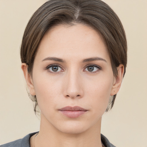 Neutral white young-adult female with short  brown hair and brown eyes