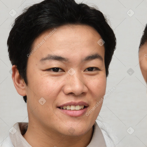 Joyful asian young-adult male with short  brown hair and brown eyes