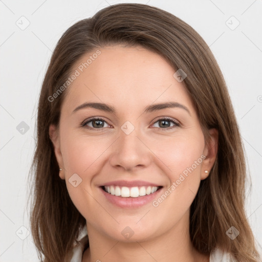 Joyful white young-adult female with long  brown hair and grey eyes