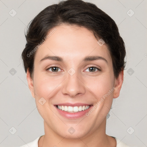 Joyful white young-adult female with short  brown hair and brown eyes