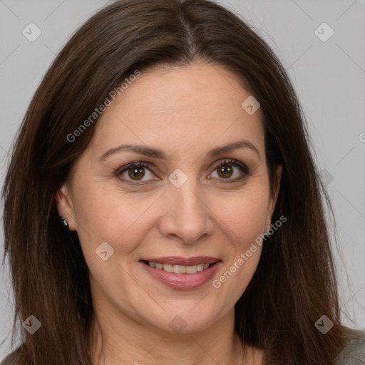 Joyful white adult female with long  brown hair and brown eyes