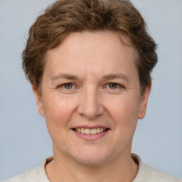 Joyful white adult female with short  brown hair and brown eyes