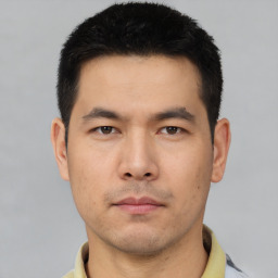 Neutral asian young-adult male with short  black hair and brown eyes