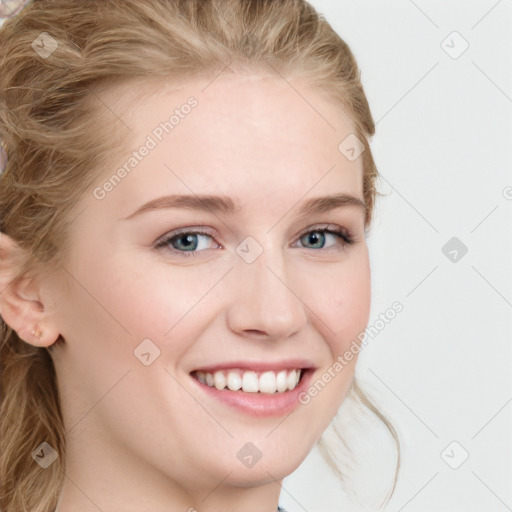 Joyful white young-adult female with long  brown hair and blue eyes