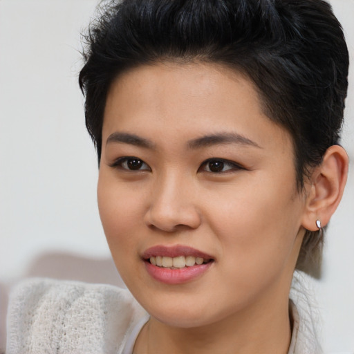 Joyful asian young-adult female with short  brown hair and brown eyes