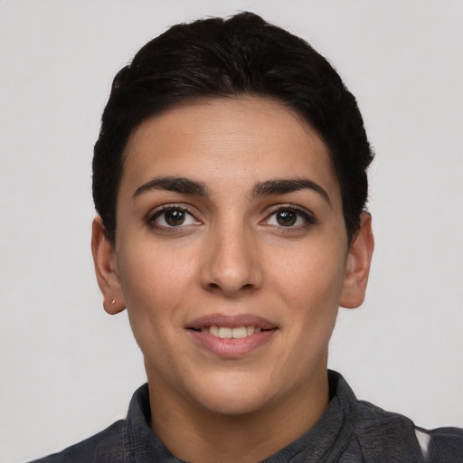 Joyful white young-adult female with short  black hair and brown eyes