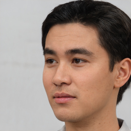 Neutral white young-adult male with short  black hair and brown eyes