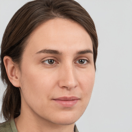 Joyful white young-adult female with medium  brown hair and brown eyes