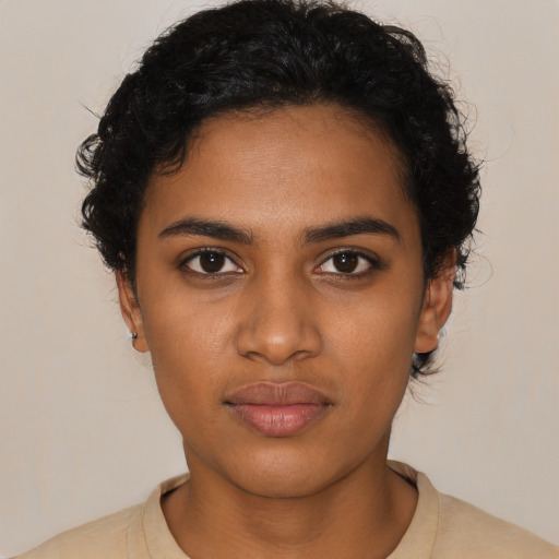 Neutral black young-adult female with short  black hair and brown eyes