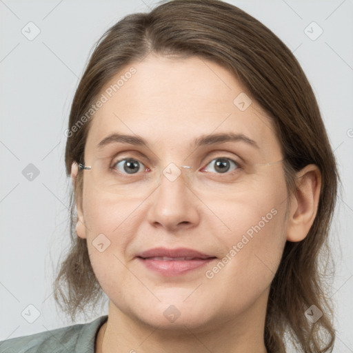 Joyful white adult female with medium  brown hair and grey eyes