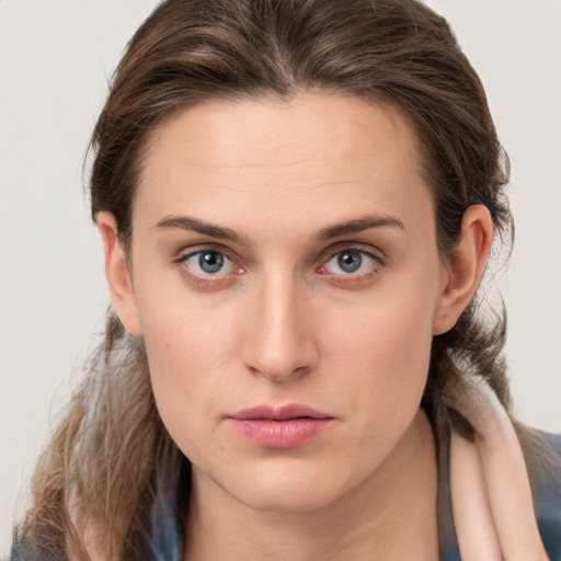 Neutral white young-adult female with medium  brown hair and grey eyes