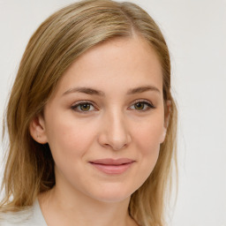 Joyful white young-adult female with medium  brown hair and blue eyes