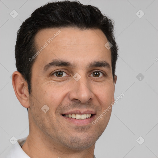 Joyful white adult male with short  brown hair and brown eyes