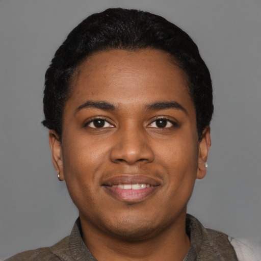 Joyful black young-adult female with short  black hair and brown eyes