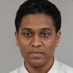 Neutral black young-adult male with short  black hair and brown eyes