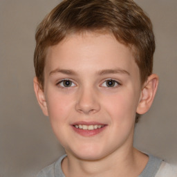 Joyful white child male with short  brown hair and brown eyes