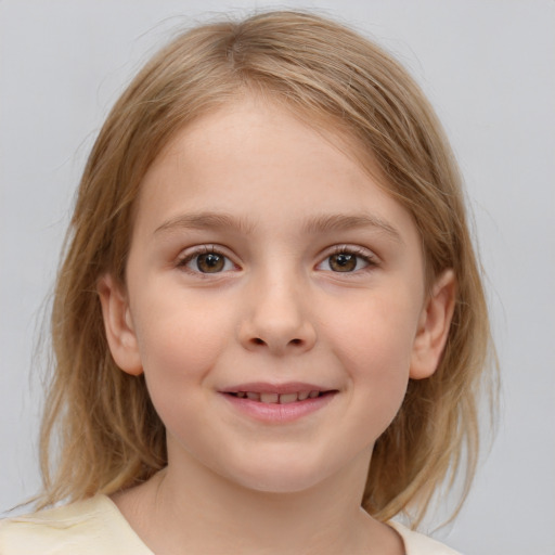 Joyful white child female with medium  brown hair and blue eyes