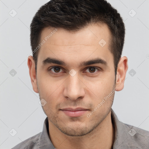 Neutral white young-adult male with short  brown hair and brown eyes