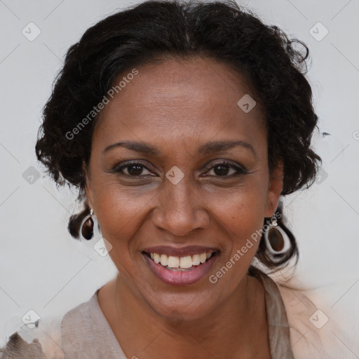 Joyful black adult female with medium  brown hair and brown eyes