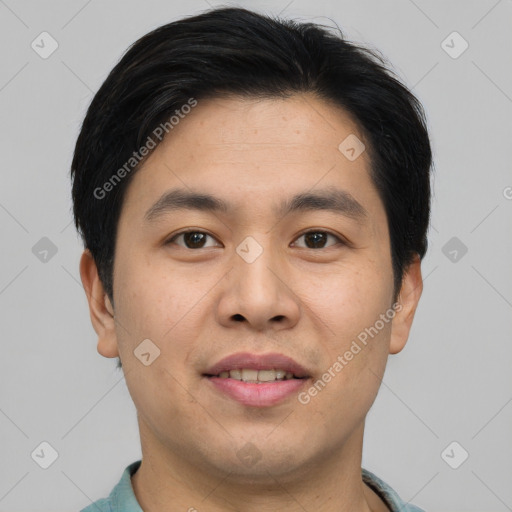 Joyful asian young-adult male with short  brown hair and brown eyes