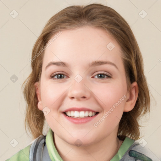 Joyful white child female with medium  brown hair and blue eyes