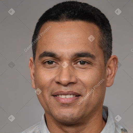 Joyful latino adult male with short  black hair and brown eyes