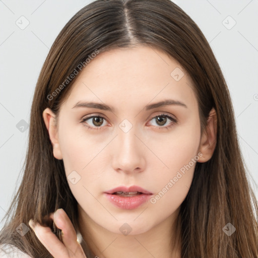 Neutral white young-adult female with long  brown hair and brown eyes